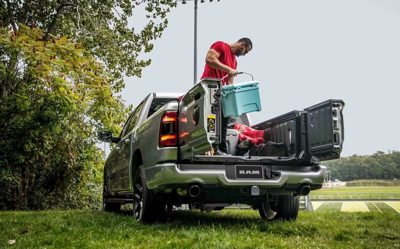 Man loading a Ram 1500 Truck Bed 